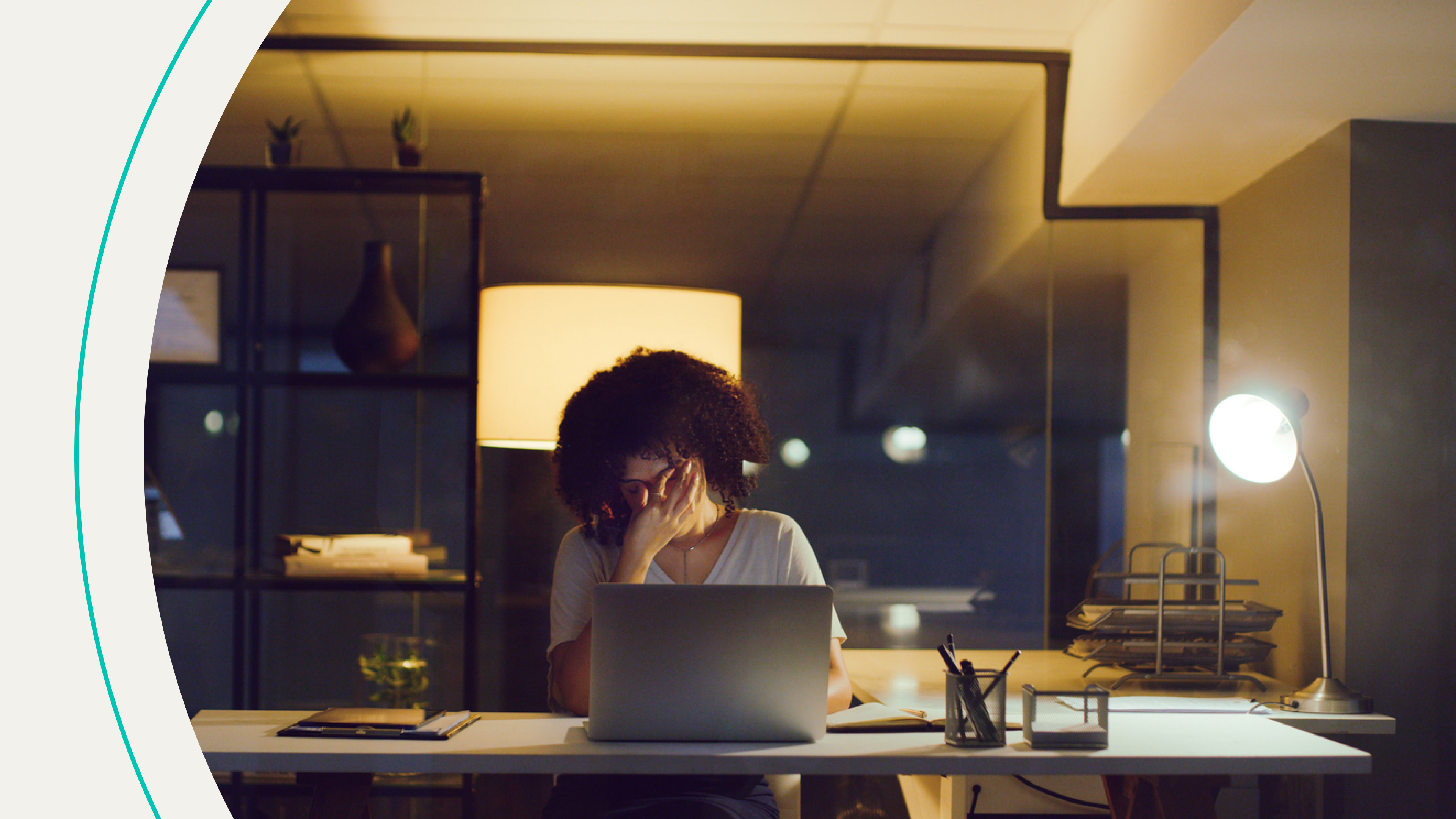 accessibility, woman covering face while at desk