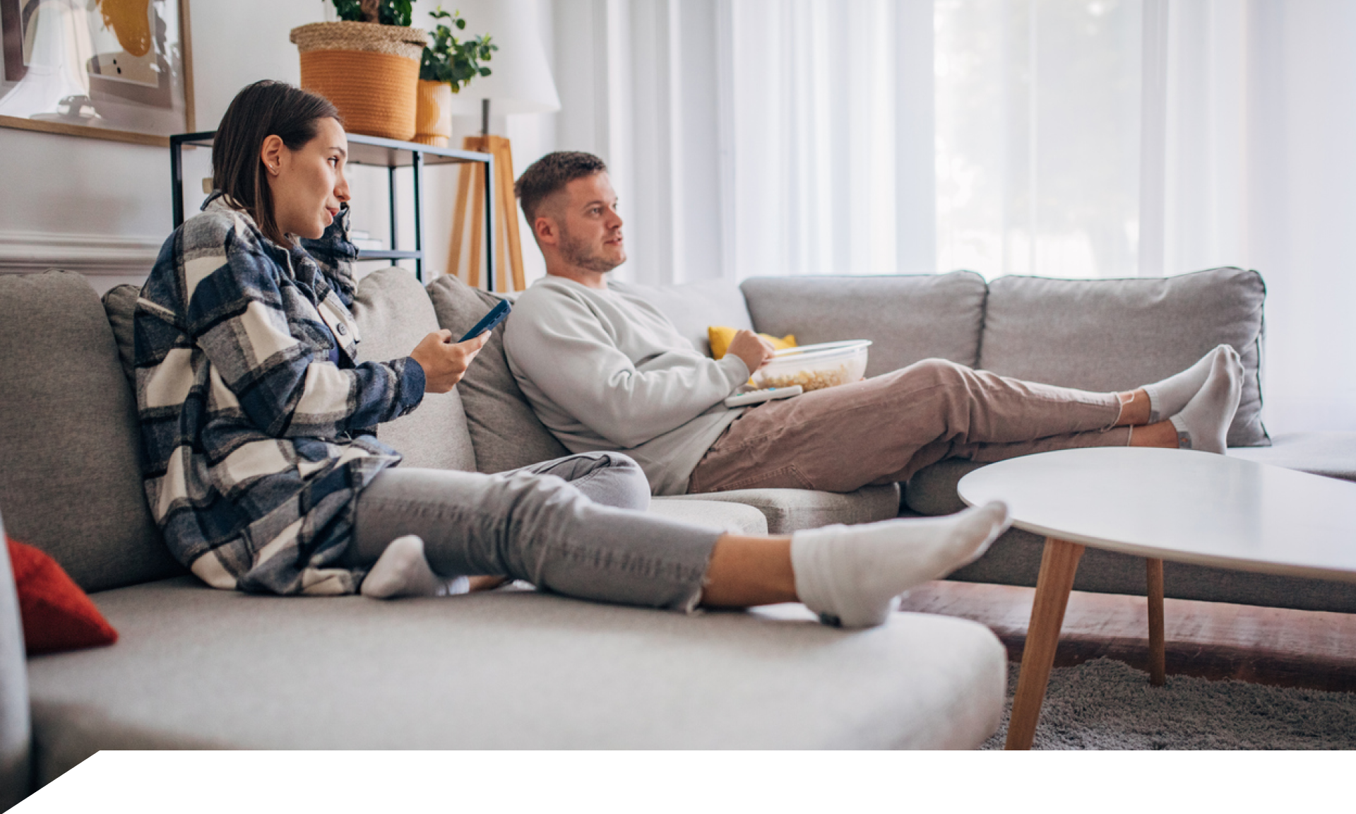 couple watching tv on couch