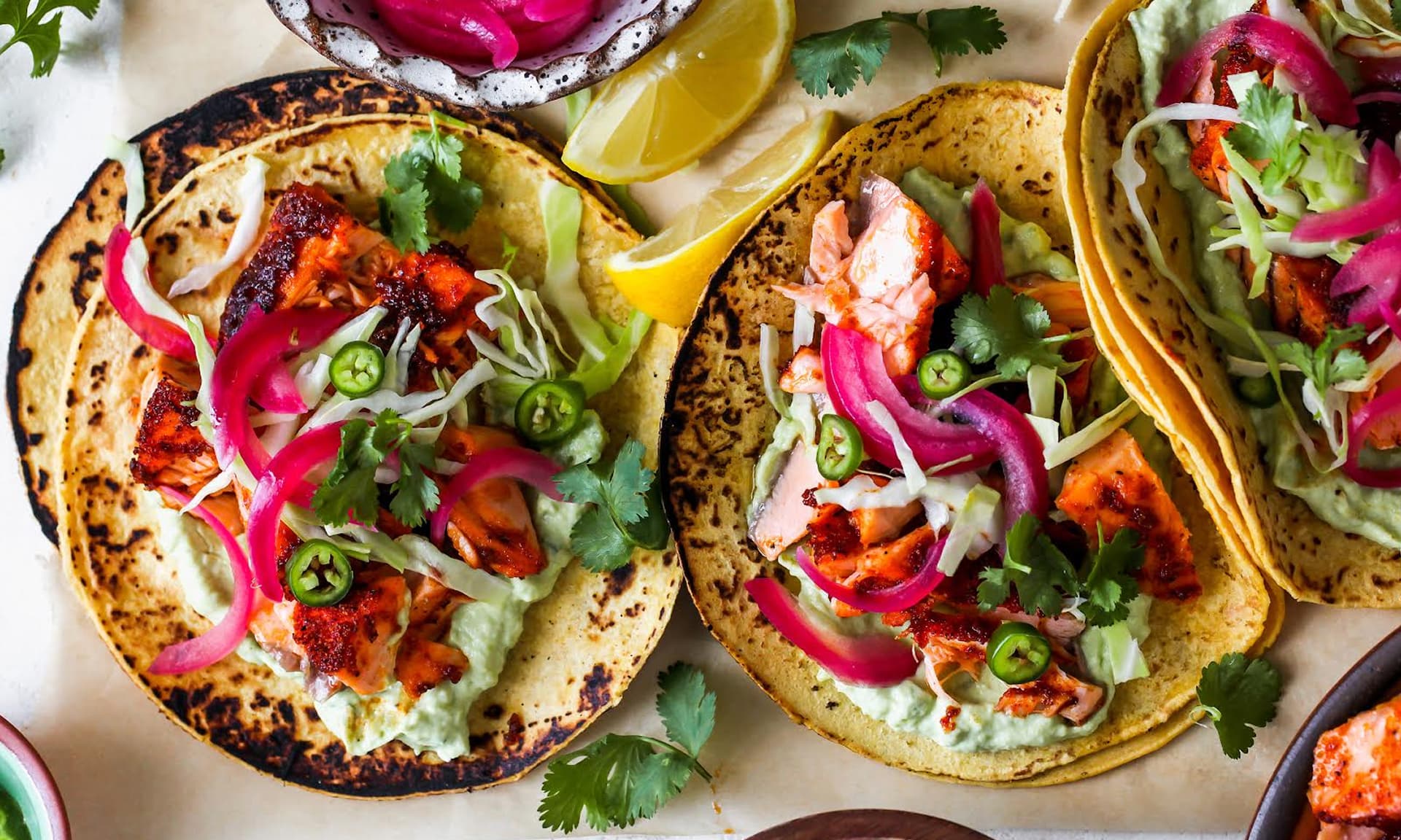 Dishing Out Health’s Salmon Tacos With Avocado Crema,