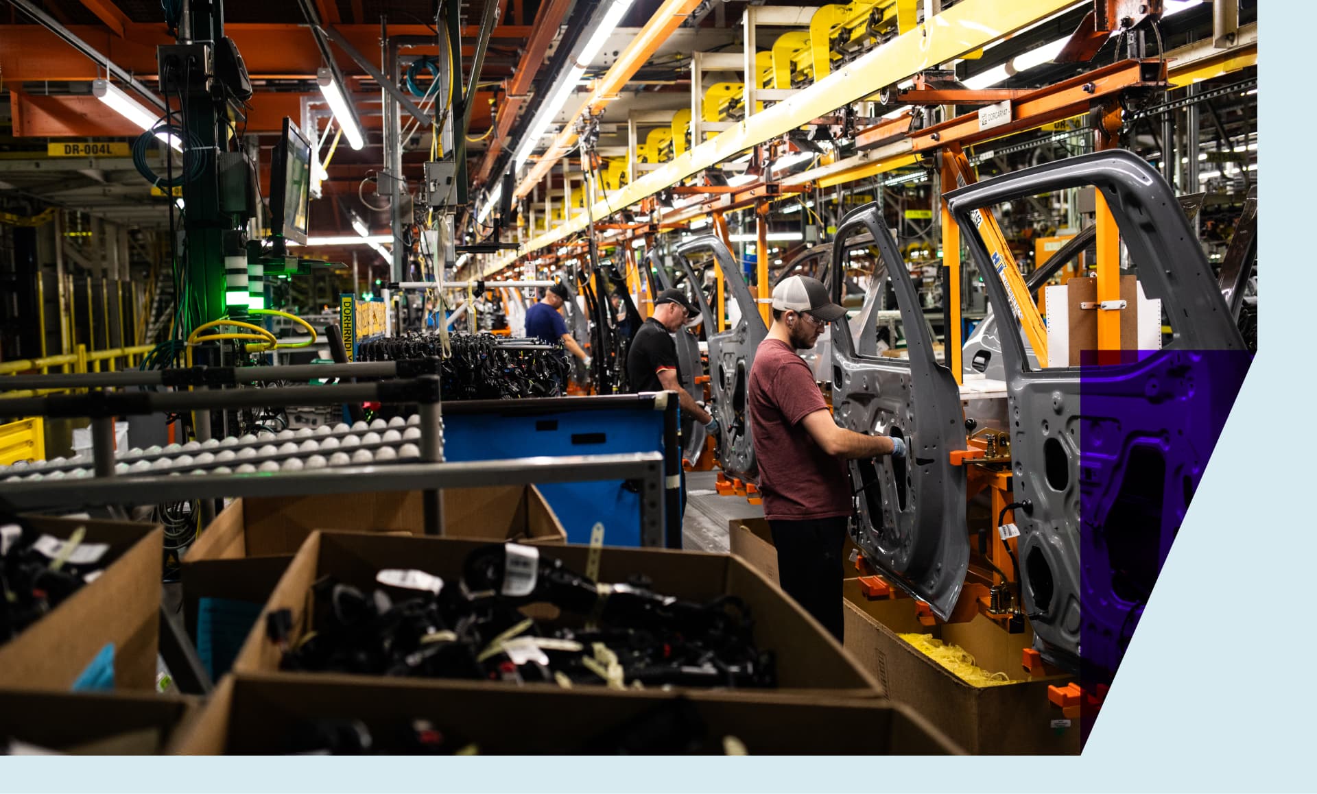 Workers assemble vehicle doors at the General Motors assembly plant in Fort Wayne, Indiana