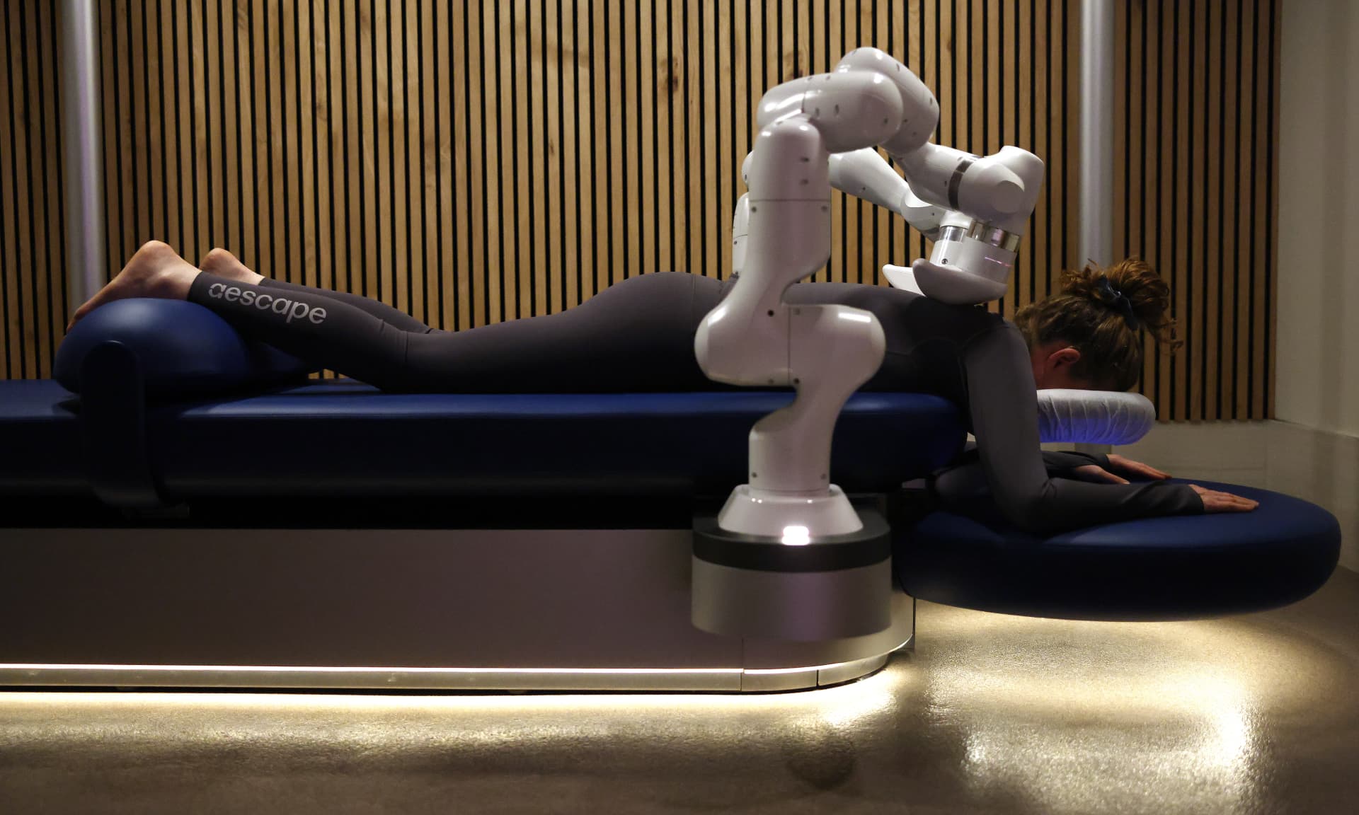Los Angeles Times reporter Deborah Vankin gets a massage by an aescape robot
