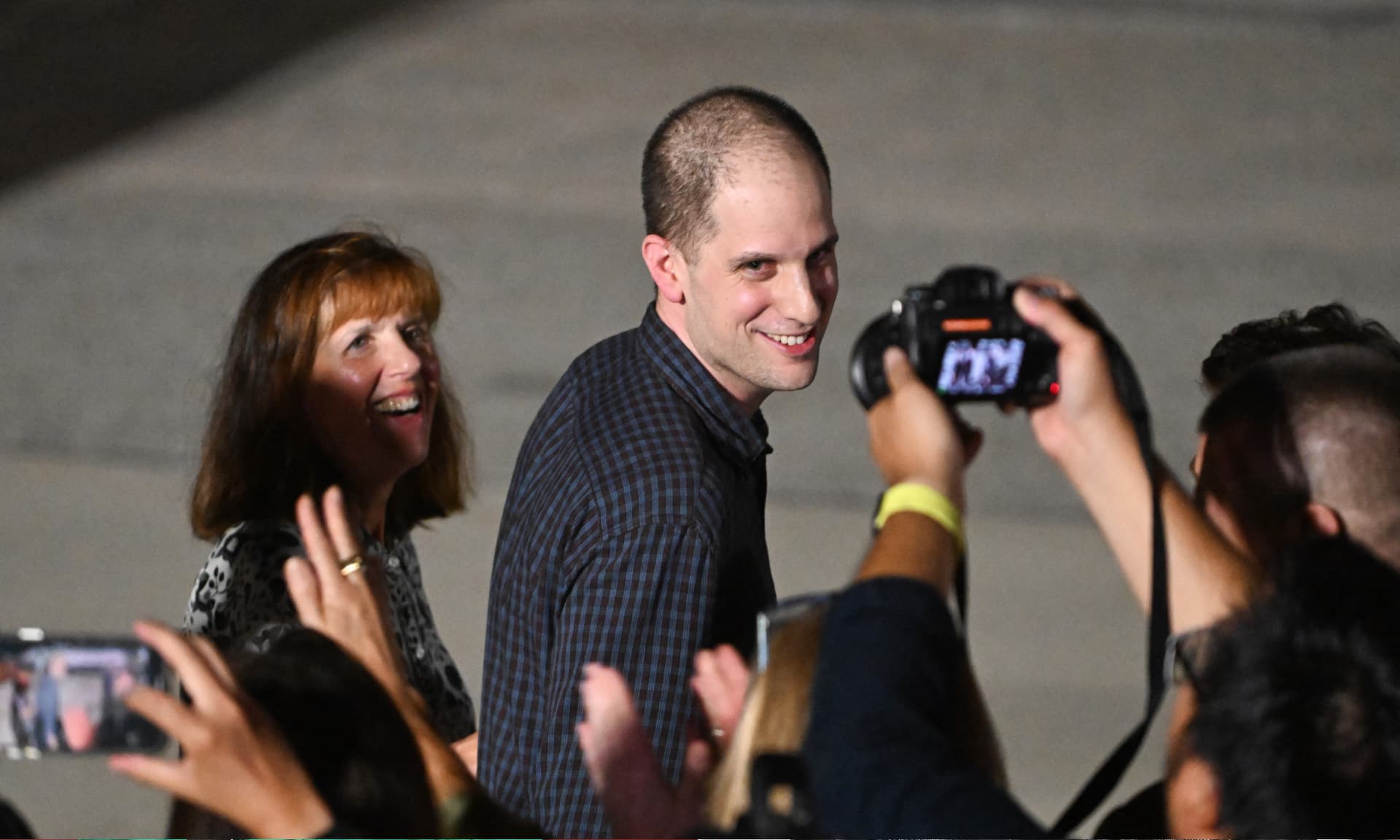 US journalist Evan Gershkovich followed by his mother Ella Milman, smiles as he arrives at Joint Base Andrews in Maryland on August 1, 2024.