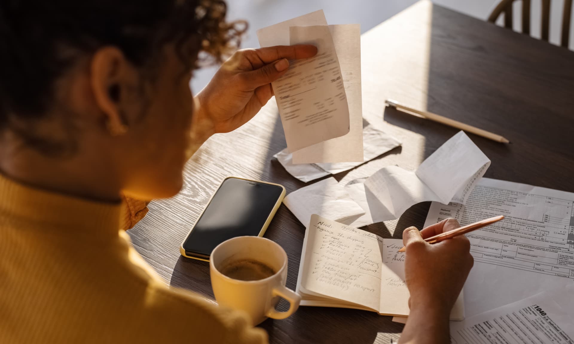 woman looking at bills